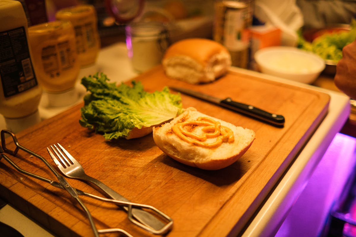 Hands assembling a sandwich